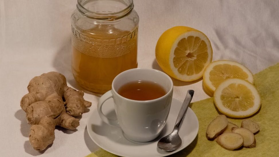 A cozy setup featuring ginger lemon tea with honey, promoting wellness and comfort.