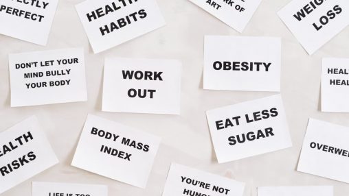Collection of motivational quotes promoting health and wellness on paper cards.